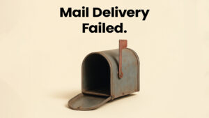 An empty, open mailbox with the text “Mail Delivery Failed” on a light background